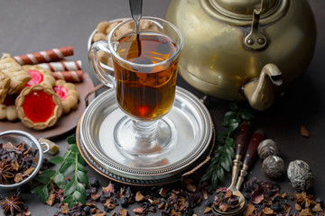 Tea hot drink on old background in composition on the table