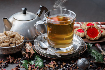 Tea hot drink on old background in composition on the table