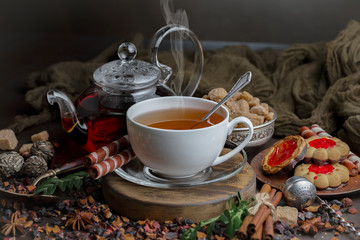 Tea hot drink on old background in composition on the table
