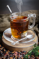 Tea hot drink on old background in composition on the table