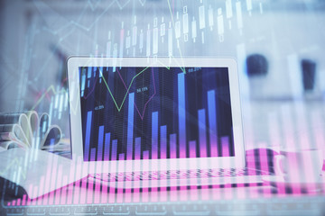 Forex Chart hologram on table with computer background. Multi exposure. Concept of financial markets.