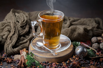 Tea hot drink on old background in composition on the table