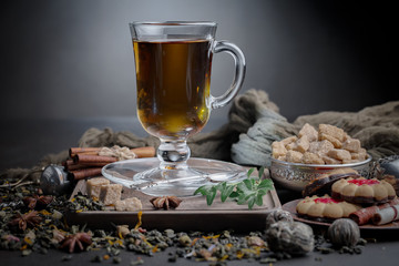 Tea hot drink on old background in composition on the table