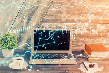 Multi exposure of chart and financial info and work space with computer background. Concept of international online trading.