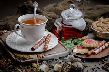 Tea hot drink on old background in composition on the table