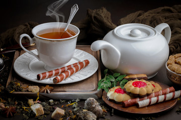 Tea hot drink on old background in composition on the table