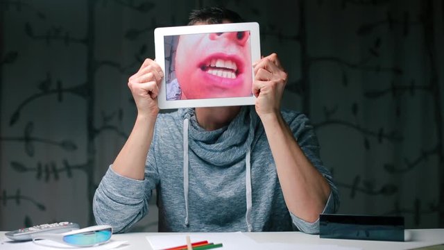 Tablet screen in the hands of a man.