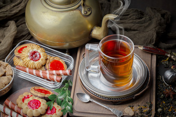 Tea hot drink on old background in composition on the table