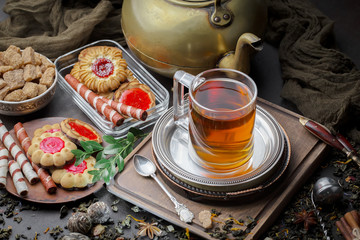 Tea hot drink on old background in composition on the table