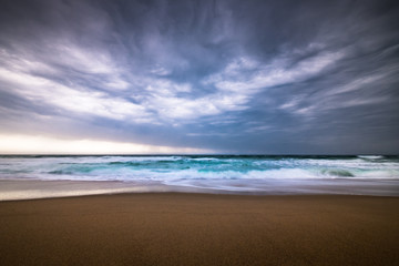 Dramatic storm clouds on a rainy day over the ocean at a beach in rhode island usa