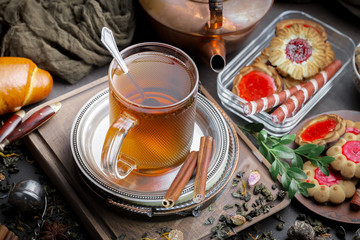 Tea hot drink on old background in composition on the table