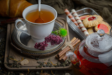 Tea hot drink on old background in composition on the table
