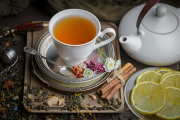 Tea hot drink on old background in composition on the table