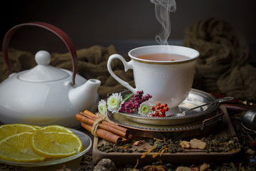 Tea hot drink on old background in composition on the table