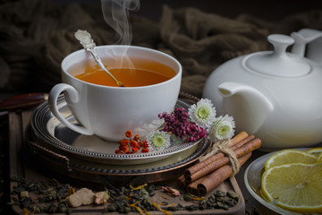Tea hot drink on old background in composition on the table