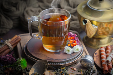 Tea in a cup on an old background