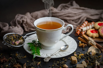 Tea hot drink on old background in composition on the table