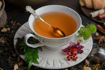 Tea hot drink on old background in composition on the table