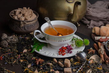 Tea hot drink on old background in composition on the table