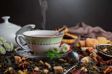 Tea hot drink on old background in composition on the table