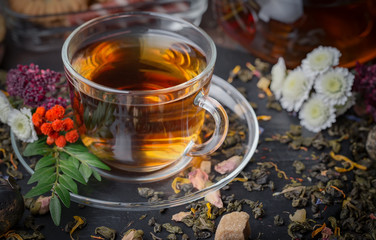 Tea hot drink on old background in composition on the table