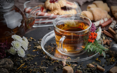 Tea hot drink on old background in composition on the table