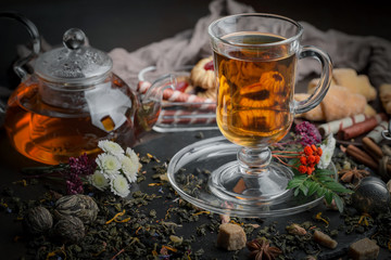 Tea hot drink on old background in composition on the table