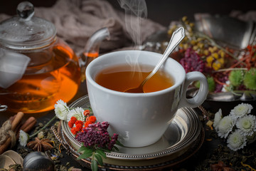 Tea hot drink on old background in composition on the table