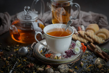 Tea hot drink on old background in composition on the table