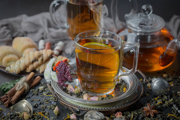 Tea hot drink on old background in composition on the table
