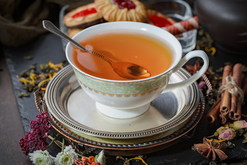 Tea in a cup on an old background