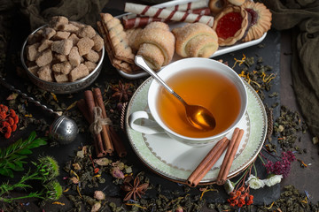 Tea hot drink on old background in composition on the table