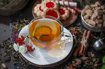 Tea hot drink on old background in composition on the table