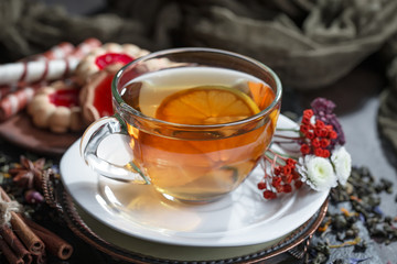 Tea hot drink on old background in composition on the table
