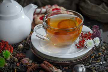 Tea hot drink on old background in composition on the table