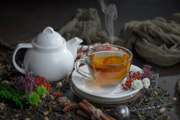 Tea hot drink on old background in composition on the table