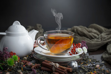 Tea hot drink on old background in composition on the table