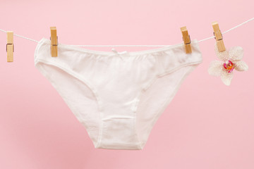 Beautiful women's cotton panties on pink background.