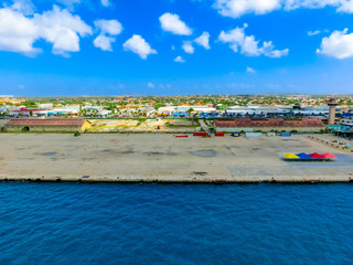 View of the main harbor on Aruba looking from a cruise ship down over the city and boats. Dutch province named Oranjestad, Aruba - beautiful Caribbean Island.