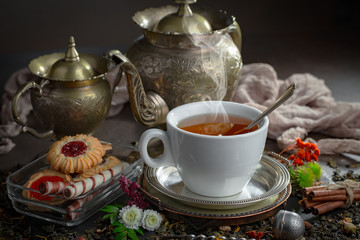 Tea in a cup on an old background