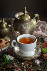 Tea in a cup on an old background