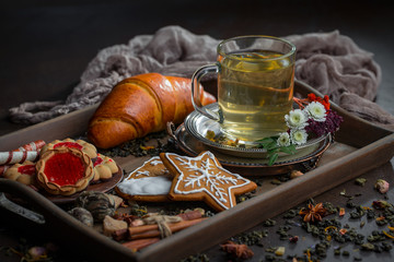 Tea hot drink on old background in composition on the table