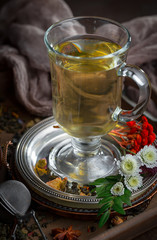 Tea hot drink on old background in composition on the table