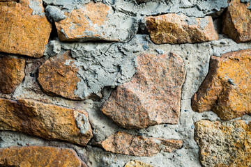 The texture of the old masonry. Background image of a stone-lined wall