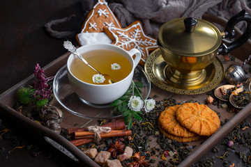 Tea hot drink on old background in composition on the table