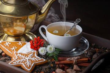 Tea hot drink on old background in composition on the table