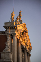 First golden sunbeams touching the facade  of Santa Maria di Nazareth or also called Chiesa degli...