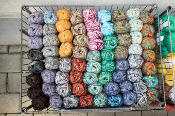Multi-colored woolen threads in wooden box for sale