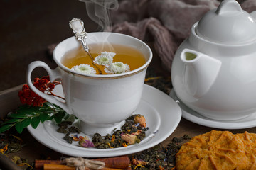 Tea hot drink on old background in composition on the table