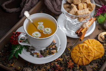 Tea hot drink on old background in composition on the table